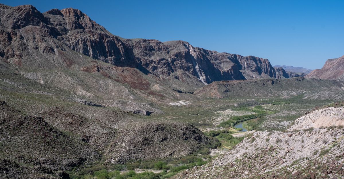 Explore the breathtaking landscape of Terlingua Valley, Texas with dramatic rocky mountains.